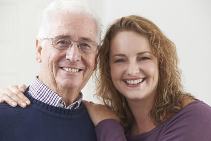 Portrait Of Smiling Senior Man With Adult Daughter