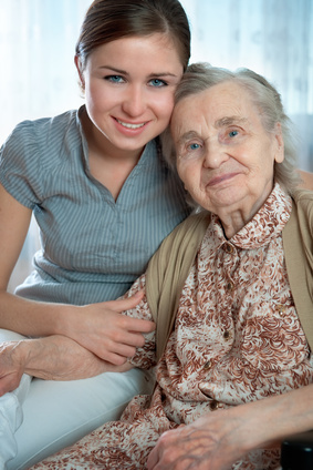 Senior woman with her home caregiver